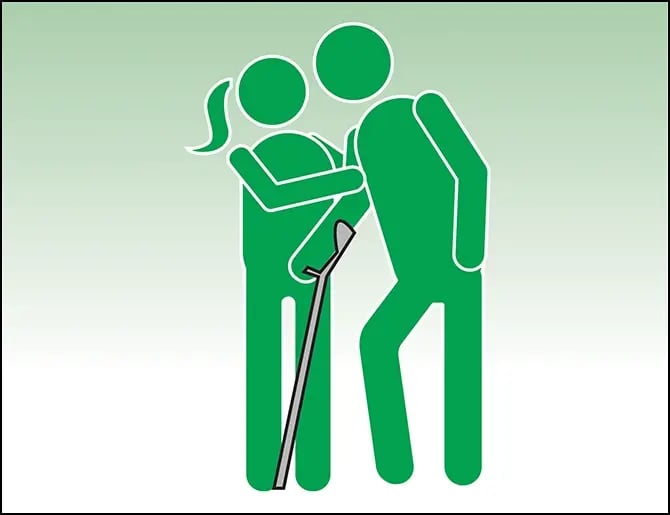 Woman assisting man with crutch