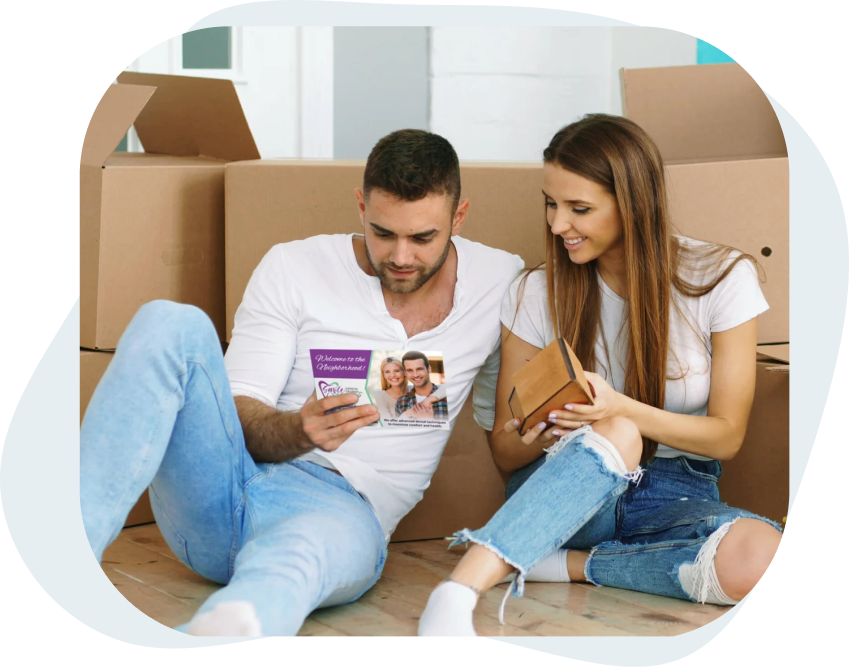 Young_Couple_In_New_House_Looking_At_A_New_Mover_Direct_Mail_Postcard