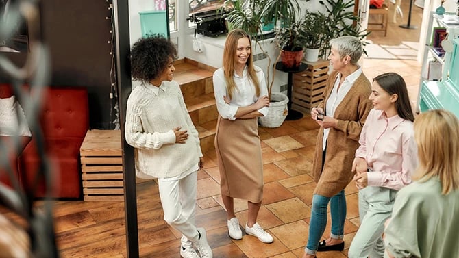 A group of women talking about the SEO performance of their hair salon SEO service.