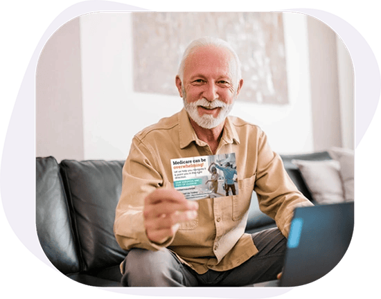 An_Older_Man_Holding_A_Direct_Mail_Postcard