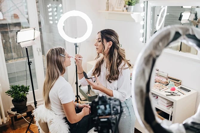 An influencer recording a vlog for a small business beauty salon.