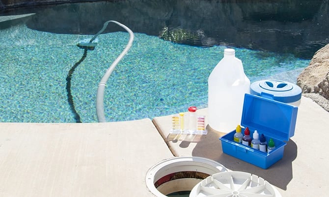 Equipment and chemicals for testing the quality of pool water beside pool openings.