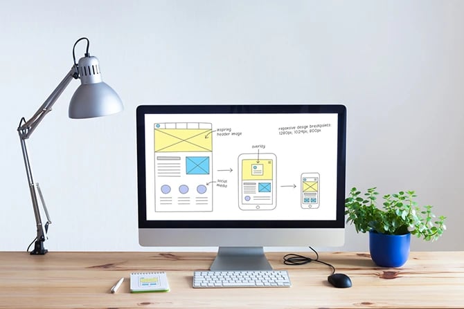 B2B web design concept on a desktop computer in bright office