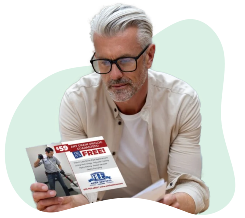 Man_Reading_Direct_Mail_Postcard_Advertisement